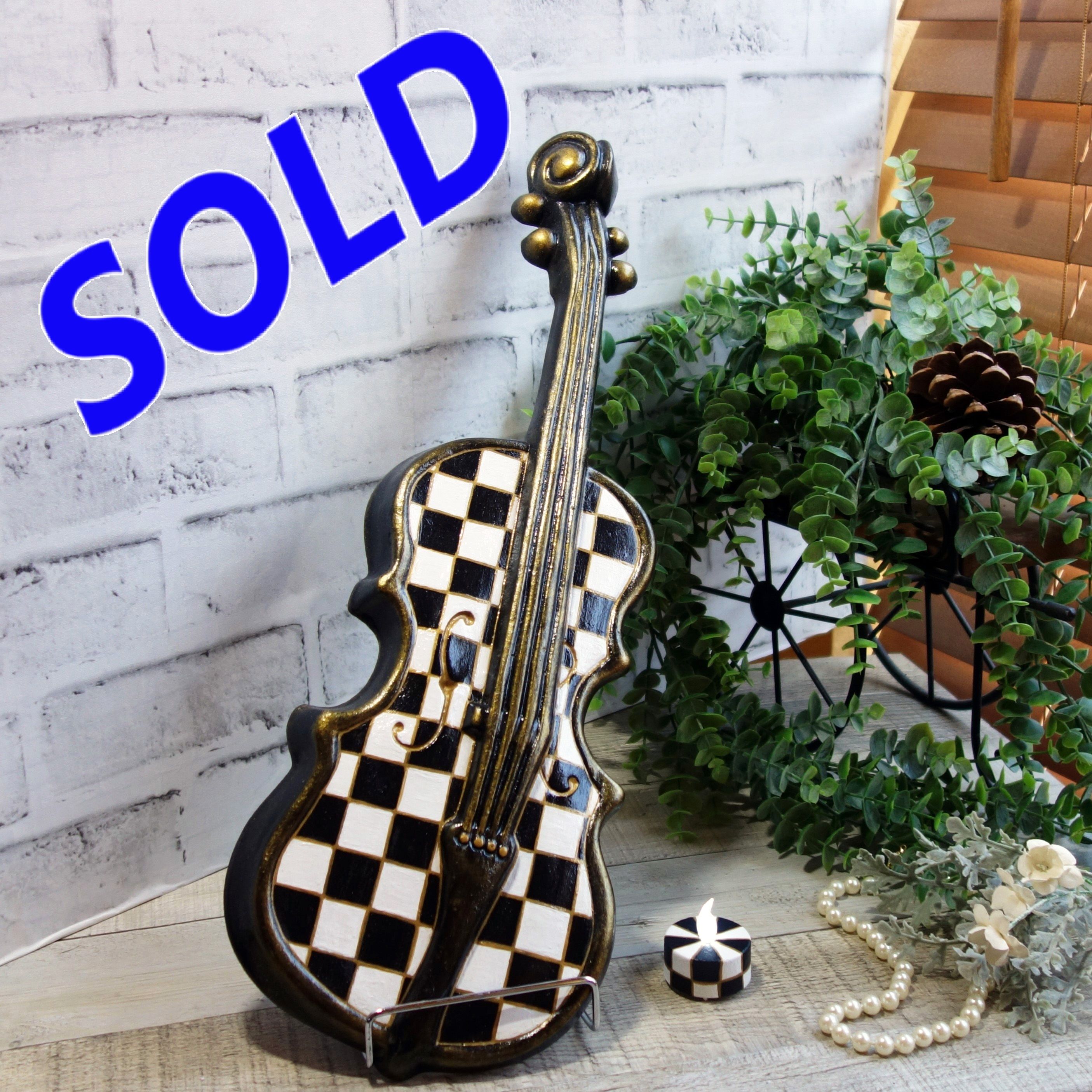Courtly Violin with Checked Candle Black and White Checked Wall Decor Checked Mantle Decor