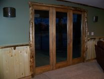 Custom Refinished Basement With Log Bar, Bar Stools And Wood Work 3 small