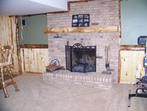Custom Refinished Basement With Log Bar, Bar Stools And Wood Work 4 small