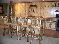Custom Refinished Basement With Log Bar, Bar Stools And Wood Work 5 small
