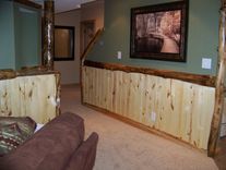 Custom Refinished Basement With Log Bar, Bar Stools And Wood Work 6 small