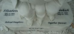 Memorial Statue of 2 Angels / Represents 2 daughter's who died in a car accident to be buried together.  2 small