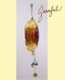 Organically Transparent Amber Pendant With Dangles On A Beadhopper 1 small