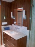Floating Vanity And Wall Panels In Black Walnut. 1 small