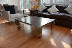 Duxbury Metal & Wood Coffee Table W/Red Wheels 1 small