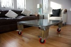 Duxbury Metal & Wood Coffee Table W/Red Wheels 3 small