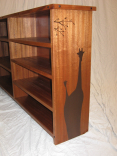 Sapelle Bookcase With Giraffe Design. 1 small