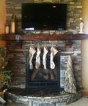 Hand Hewn Mantel With Christmas Stocking Ironwork 1 small