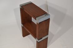 Cast-Wood Stools Rendered In Mahogany And Aluminium. 1 small