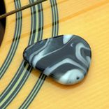 Hand-Blown Glass Guitar Pick In Blue Swirls 1 small