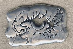 Metal Charm With Eye And Signature 1 small