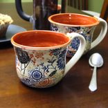 Pair Of Coffee Mugs With Multi-Colored Patterns 1 small