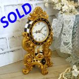 Courtly Mantle Clock Black And White Checked Baroque Clock With Cherubs 1 small
