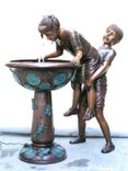 Bronze Garden Fountain, of a boy giving his sister a boost 1 small