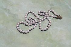 Trompe L'Oeil Bead Necklace Painted On Faux Marble Table Surface. 2 small